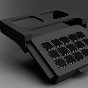 May include: A black, rectangular, keyboard-like device with a hinged lid. The lid is open, revealing a grid of 16 black buttons.