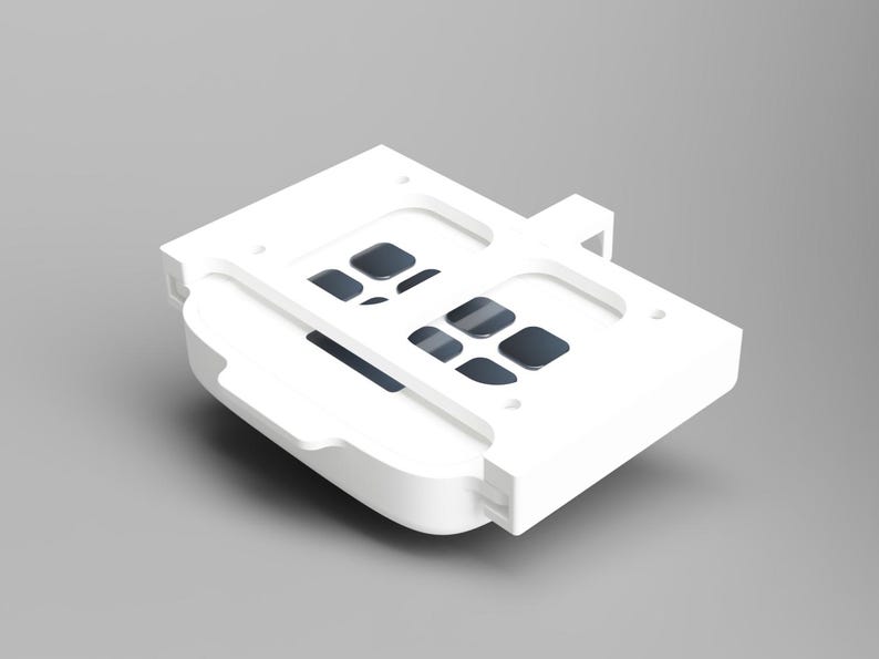 May include: White plastic case with a grid of small, rectangular openings. The case is designed to hold and protect small items.