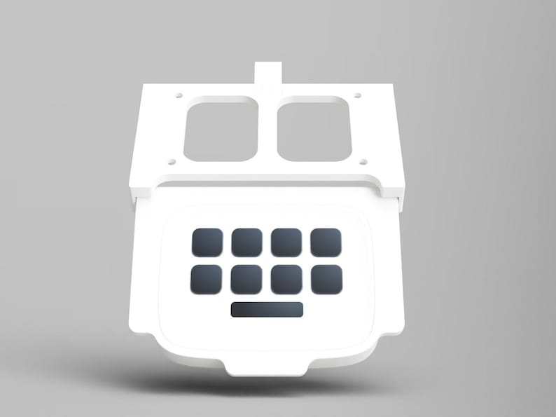 May include: White plastic keyboard with a number pad and a space bar. The keyboard is attached to a white plastic frame with two rectangular openings.