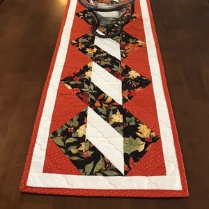Evergreen Ribbon Quilted Table Topper NCU0NTD344