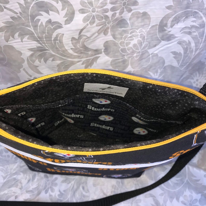 Pittsburgh Steelers Crossbody BagPurse Front Zipper Pocket and Adjustable Strap Black Helmet on Black with Secure Zipper Closure