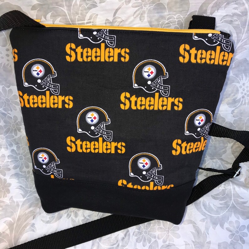 Pittsburgh Steelers Crossbody BagPurse Front Zipper Pocket and Adjustable Strap Black Helmet on Black with Secure Zipper Closure