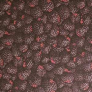 May include: A fabric pattern featuring a dense, repeating print of dark purple and black blackberries. The individual drupelets of the berries are textured with small white highlights and occasional bright red accents throughout the surface.