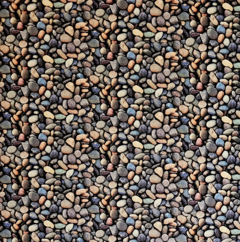 May include: A seamless pattern of various sized and colored stones. The stones are arranged in a diagonal pattern, creating a textured background.
