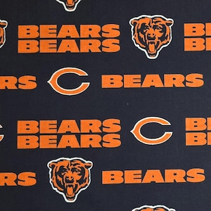 May include: Navy blue fabric featuring the Chicago Bears logo and wordmark in orange and white. The design includes the team's bear head logo, the word "BEARS" in a stacked format, and the letter "C".