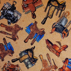 Saddle fabric, Tossed Saddles, DCX11305, By Michael Miller. Fabric by the yard & half yard. Horse fabric, saddle fabric, cowboy fabric.