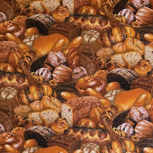 May include: A fabric pattern featuring a variety of baked goods, including loaves of bread, rolls, and pastries. The image showcases a mix of golden-brown and dark-brown colors, with some items arranged in wicker baskets. The overall theme is bakery and food.