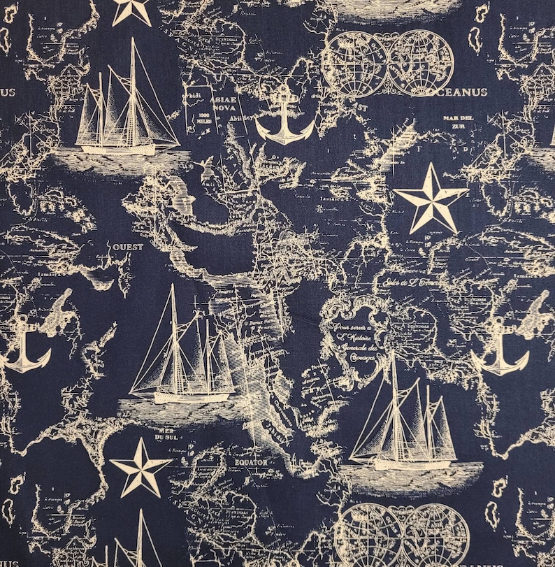 May include: A navy blue fabric with a white and cream nautical map pattern. The pattern includes ships, anchors, stars, and globes. The text "OCEANUS" and "ASIAE NOVA" are visible on the map.