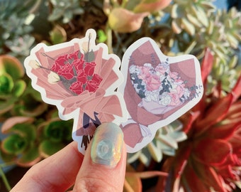 May include: Two sticker sheets featuring bouquets of flowers. One sheet has a bouquet of red roses with white accents, and the other sheet has a bouquet of pink and white flowers with green accents.