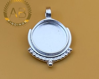 May include: Silver-toned pendant with a circular bezel setting, perfect for jewelry making. The pendant has a decorative beaded edge and a loop for a chain. The logo "AB FINDINGS GET A PERFECT MATCH" is in the upper left corner.