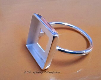 May include: Silver ring with a square bezel setting. The bezel is open on all sides, allowing for a square cabochon to be set in the ring.
