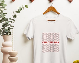 May include: White t-shirt with the phrase "CHAOTIC GAY" repeated in red text.