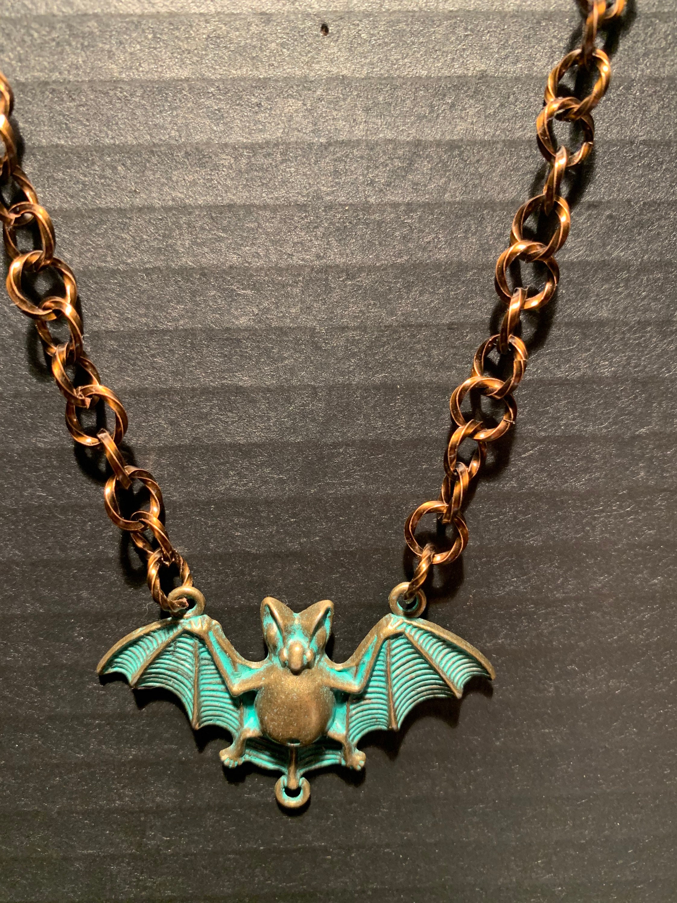 Twisted Metal Bat necklace