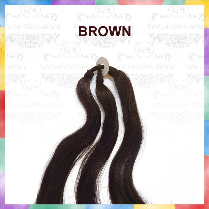 May include: Three strands of long, dark brown human hair extensions. The hair is tied together with a rubber band and is ready to be used.