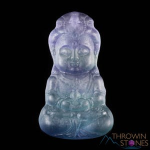 These rainbow Fluorite crystal pendants are carved in the shape of seated Buddha, with a small hole drilled.  Rainbow Fluorite is striated in sheer green, teal, and purple.
Crystals are nature-made therefore each one is unique in appearance.