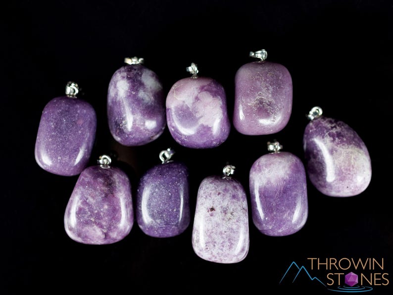 These purple Lepidolite crystal pendants are polished and freeform in shape.
Crystals are nature-made therefore each one is unique in appearance.