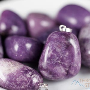 These purple Lepidolite crystal pendants are polished and freeform in shape.
Crystals are nature-made therefore each one is unique in appearance.