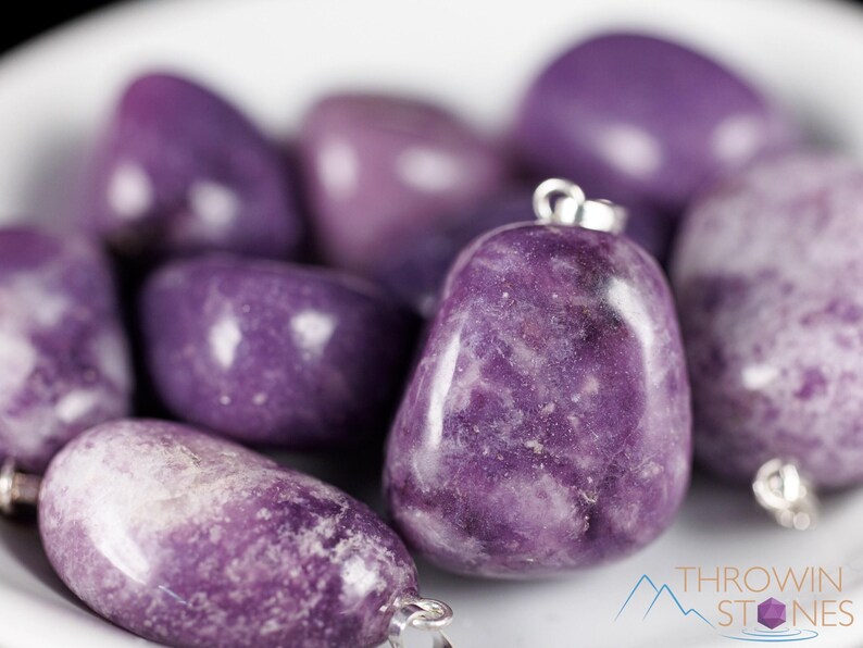 These purple Lepidolite crystal pendants are polished and freeform in shape.
Crystals are nature-made therefore each one is unique in appearance.
