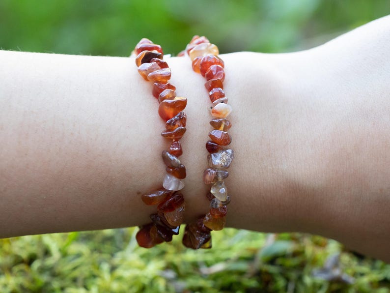 Carnelian chip bracelet. These tumbled chips range in color from orange to red, are drilled and strung on an elastic cord, and create an endless bracelet.