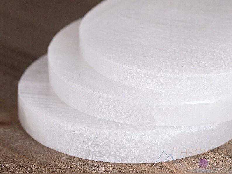 These are white Selenite crystal carved polished discs.
Crystals are nature-made therefore each one is unique in appearance.