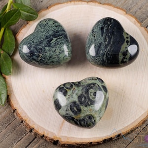 Kamaba Jasper is marbled many shades of green with round green splotches.
Crystals are nature-made therefore each one is unique in appearance.