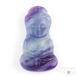 These rainbow Fluorite crystal pendants are carved in the shape of seated Buddha, with a small hole drilled.  Rainbow Fluorite is striated in sheer green, teal, and purple.
Crystals are nature-made therefore each one is unique in appearance.