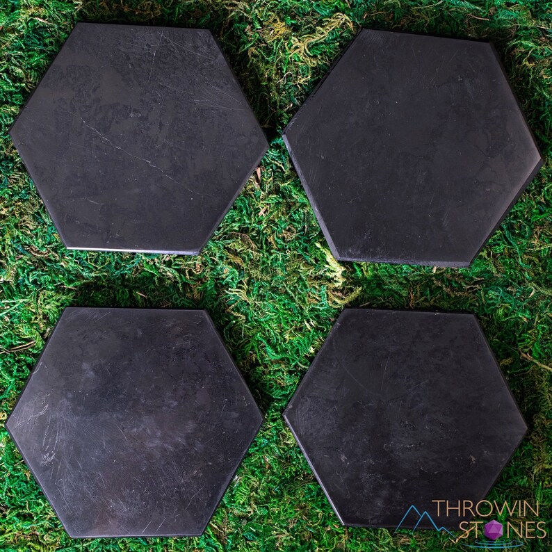These are black Shungite crystal carved polished flat plate hexagons.
Crystals are nature-made therefore each one is unique in appearance.