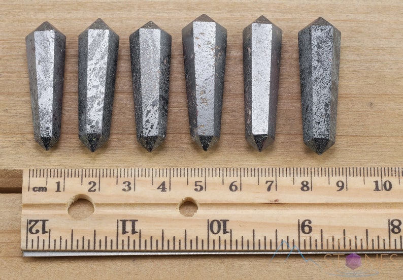 Hematite Mini Crystal Points. These metallic grey miniature wands are double terminated with a polished finish. Each gemstone is unique and will vary in size, shape, and color. These miniature points are great for jewelry making and crystal decor.