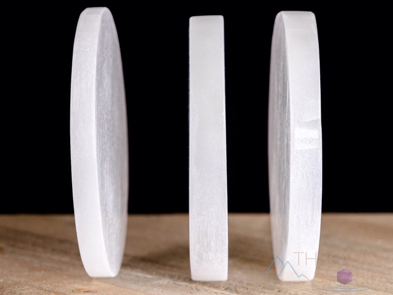 These are white Selenite crystal carved polished discs.
Crystals are nature-made therefore each one is unique in appearance.