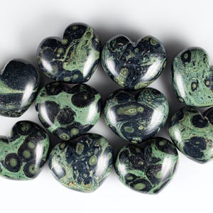 Kamaba Jasper is marbled many shades of green with round green splotches.
Crystals are nature-made therefore each one is unique in appearance.