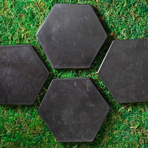 These are black Shungite crystal carved polished flat plate hexagons.
Crystals are nature-made therefore each one is unique in appearance.