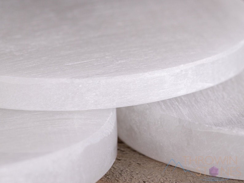 These are white Selenite crystal carved polished discs.
Crystals are nature-made therefore each one is unique in appearance.