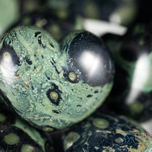 Kamaba Jasper is marbled many shades of green with round green splotches.
Crystals are nature-made therefore each one is unique in appearance.