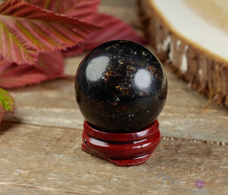 Genuine Amber Crystal Spheres. These semi precious orange crystal balls are between 15 and 40 millimeters in diameter and weigh between 1 and 40 grams. This listing has variations and only medium large and extra large spheres will come with a stand.