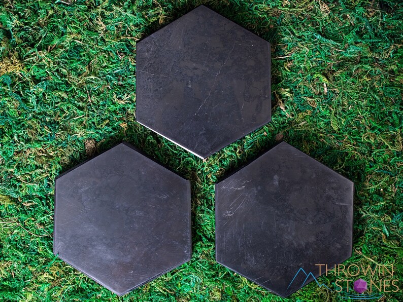 These are black Shungite crystal carved polished flat plate hexagons.
Crystals are nature-made therefore each one is unique in appearance.