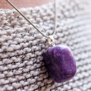 These purple Lepidolite crystal pendants are polished and freeform in shape.
Crystals are nature-made therefore each one is unique in appearance.