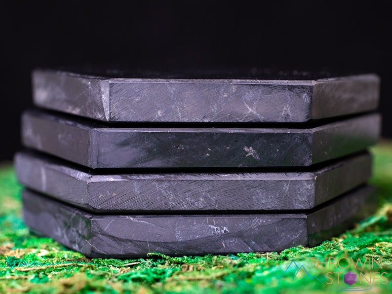 These are black Shungite crystal carved polished flat plate hexagons.
Crystals are nature-made therefore each one is unique in appearance.