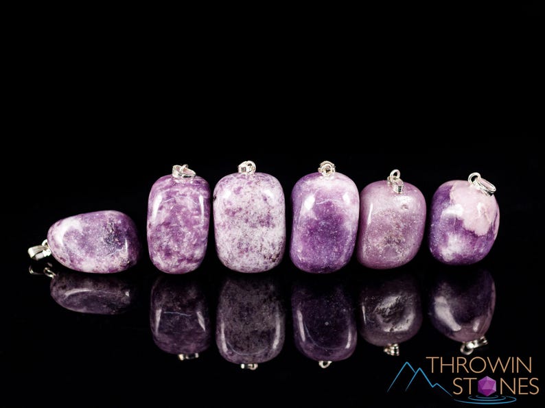 These purple Lepidolite crystal pendants are polished and freeform in shape.
Crystals are nature-made therefore each one is unique in appearance.