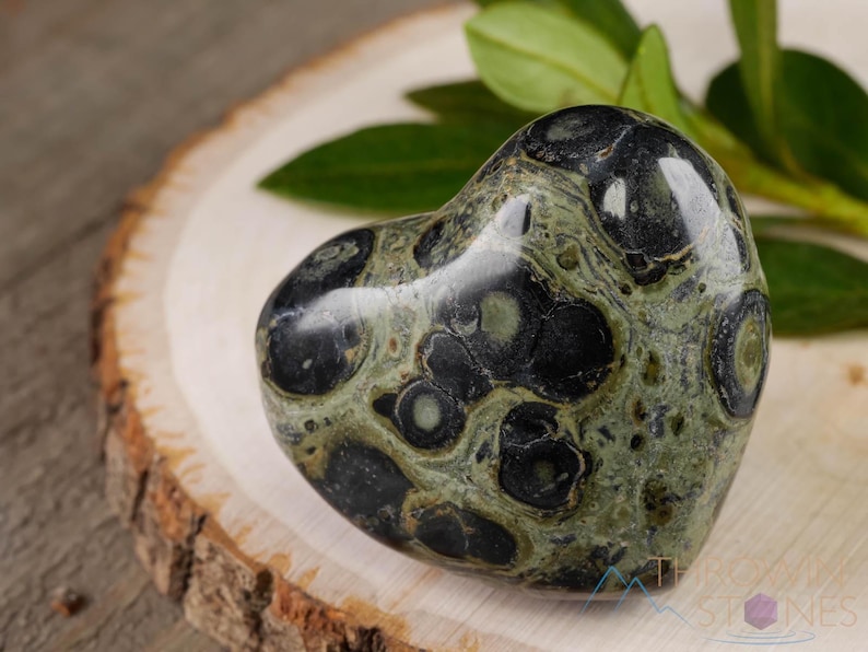 Kamaba Jasper is marbled many shades of green with round green splotches.
Crystals are nature-made therefore each one is unique in appearance.