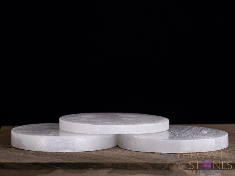 These are white Selenite crystal carved polished discs.
Crystals are nature-made therefore each one is unique in appearance.