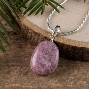 These purple Lepidolite crystal pendants are polished and freeform in shape.
Crystals are nature-made therefore each one is unique in appearance.
