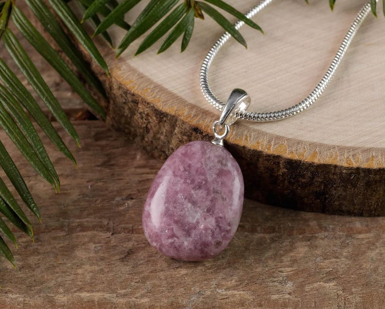 These purple Lepidolite crystal pendants are polished and freeform in shape.
Crystals are nature-made therefore each one is unique in appearance.