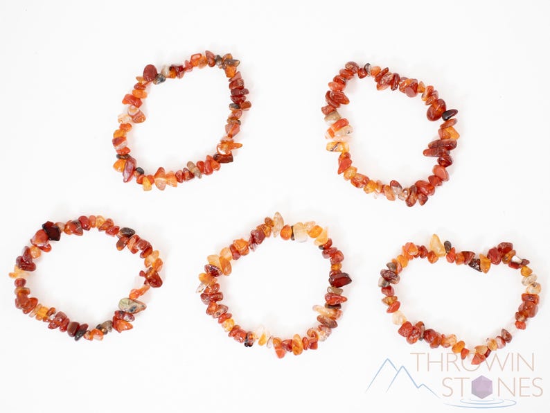 Carnelian chip bracelet. These tumbled chips range in color from orange to red, are drilled and strung on an elastic cord, and create an endless bracelet.