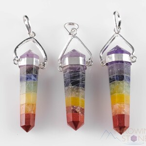 These rainbow chakra crystal pendants are polished double terminated points held in a silver bail.  The points are a composite of different crystals.
Crystals are nature-made therefore each one is unique in appearance.