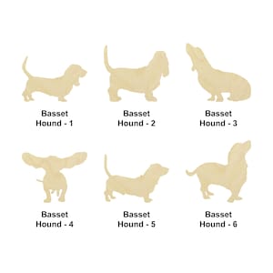 May include: Six cutout silhouettes of Basset Hounds in various poses. The silhouettes are made of light brown wood and are arranged in two rows of three.