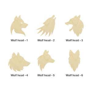 Peut inclure: Six formes de tête de loup en bois différentes, chacune avec un design unique. Les têtes de loup sont découpées dans du bois et ont une couleur bois naturelle.