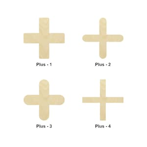 May include: Four wooden plus signs in different sizes. The plus signs are all made of light brown wood and have a smooth finish. The plus signs are labeled "Plus - 1", "Plus - 2", "Plus - 3", and "Plus - 4".