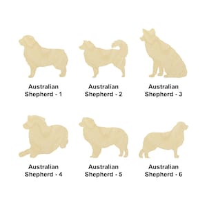 May include: Six different wood cutouts of Australian Shepherds in various poses. The cutouts are all in a light brown color and are arranged in a grid pattern.