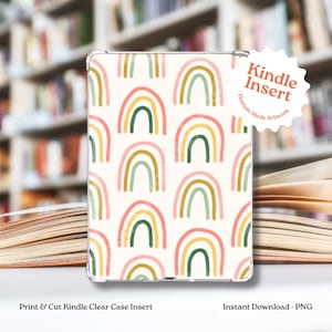 May include: Clear Kindle case insert with a repeating pattern of colorful rainbows in shades of pink, green, and yellow on a cream background. The text "Kindle Insert" is visible. The text "Print & Cut Kindle Clear Case Insert" and "Instant Download - PNG" are also visible.