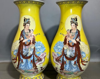 A pair of exquisitely hand-painted Chinese antique Guanyin phoenix-tail vases with open windows.